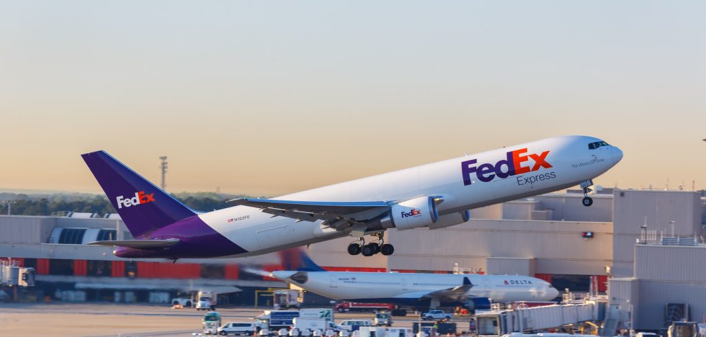 FedEx airplane taking off in airport