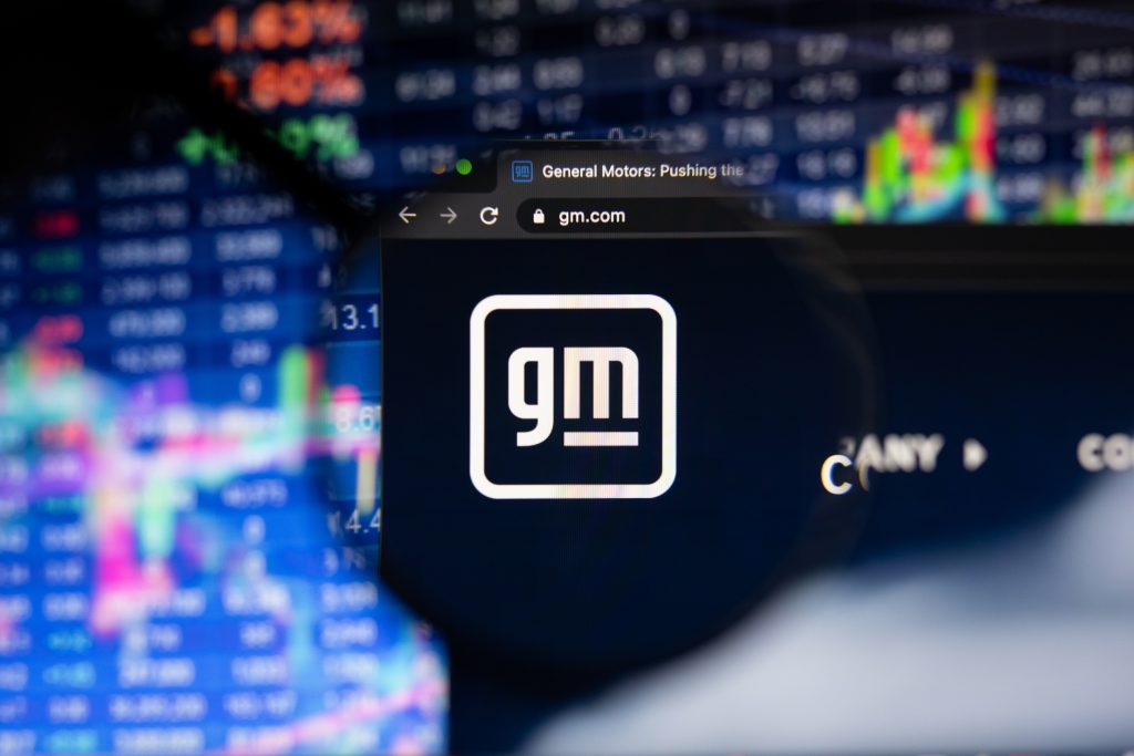 General Motors logo with stocks background