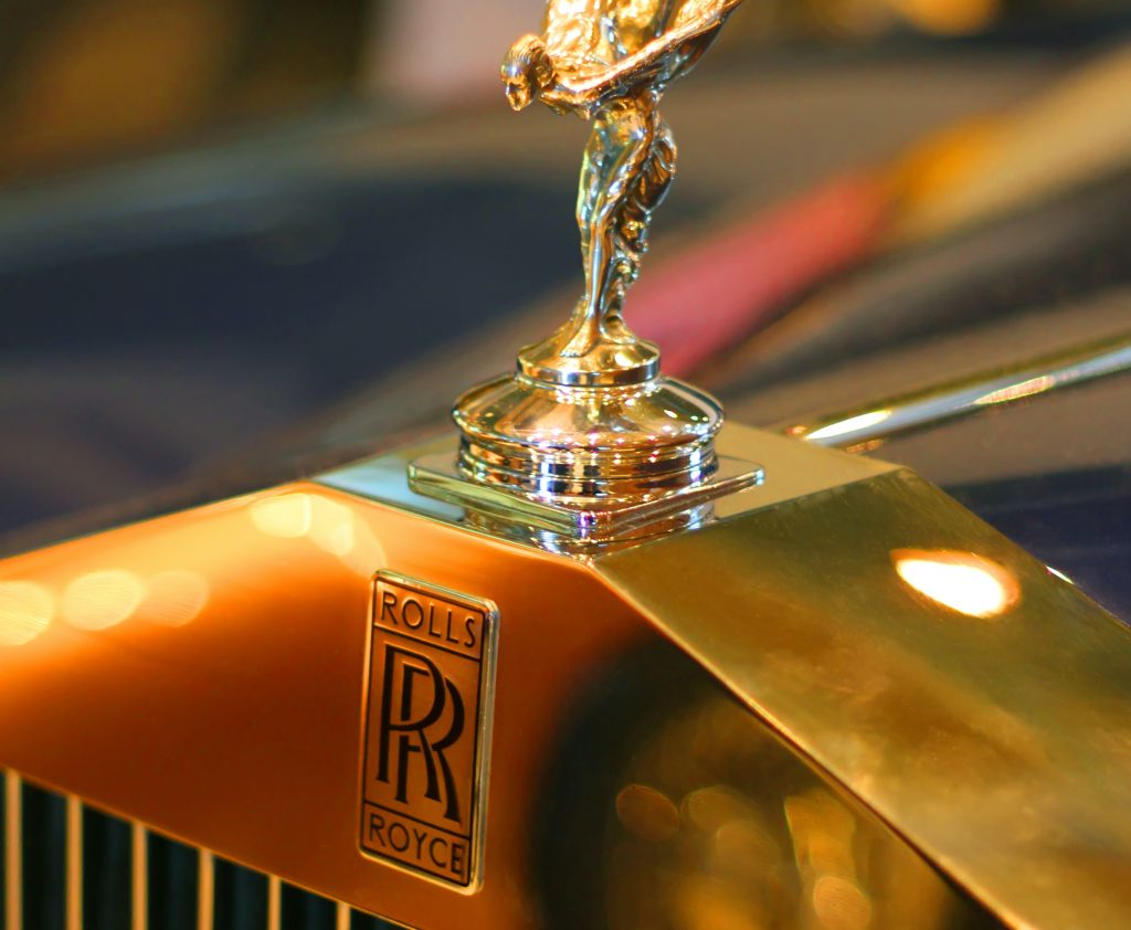Rolls-Royce logo in front of classic car