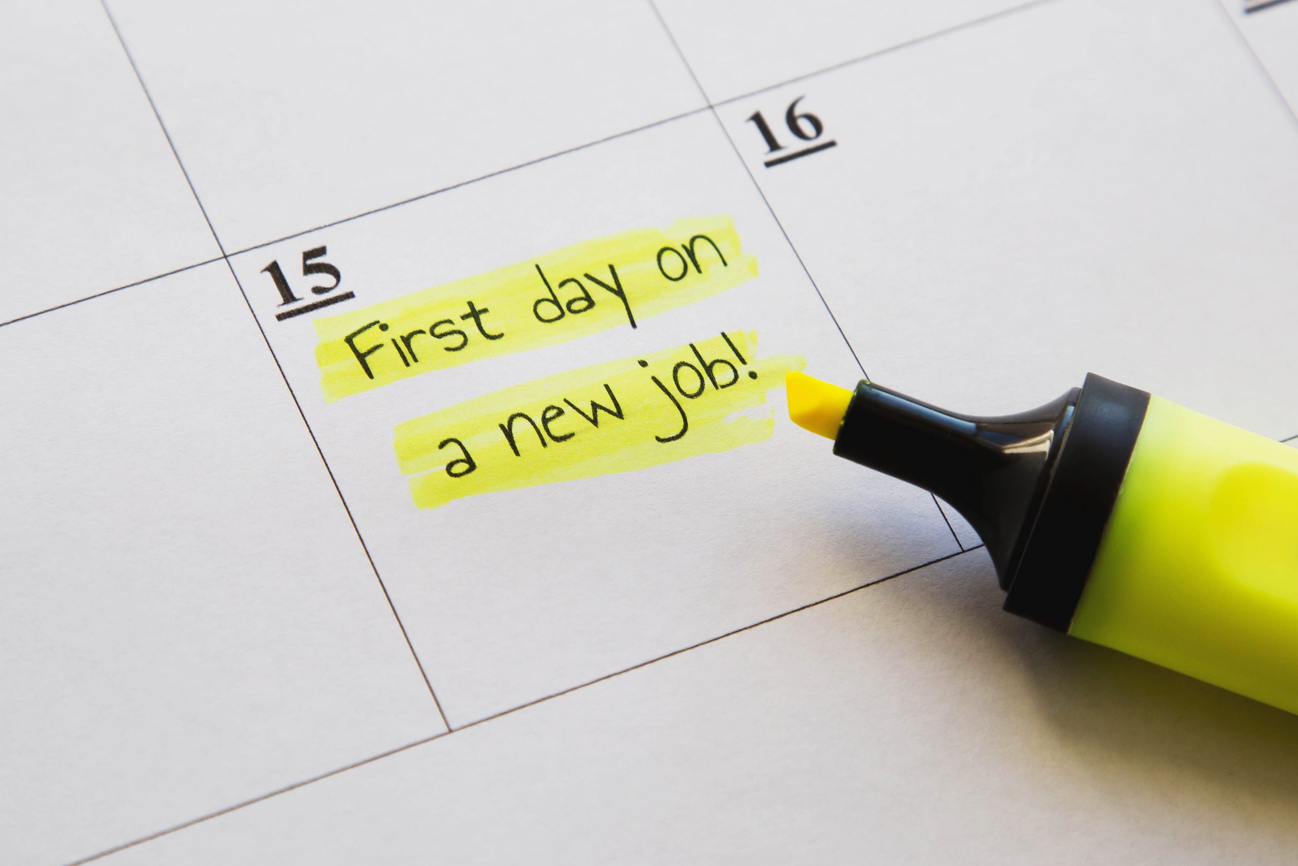 A calendar is marked with the wording "First day on a new job!"