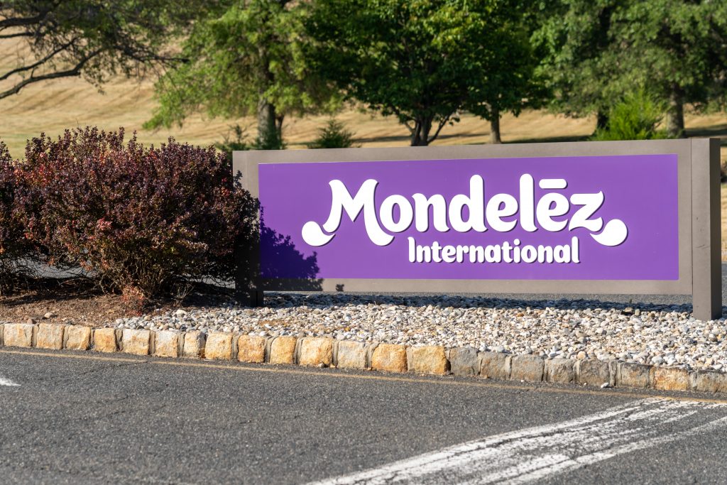 Sign showing the Mondelez International logo in a parking lot