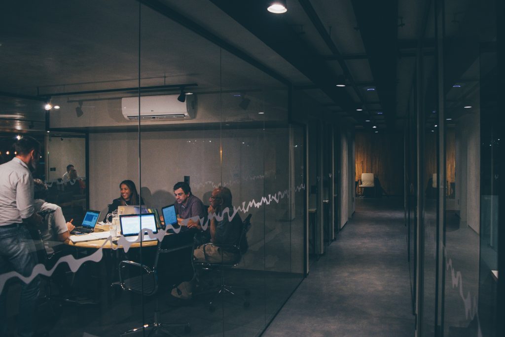 Dark office with employees working in a centered way