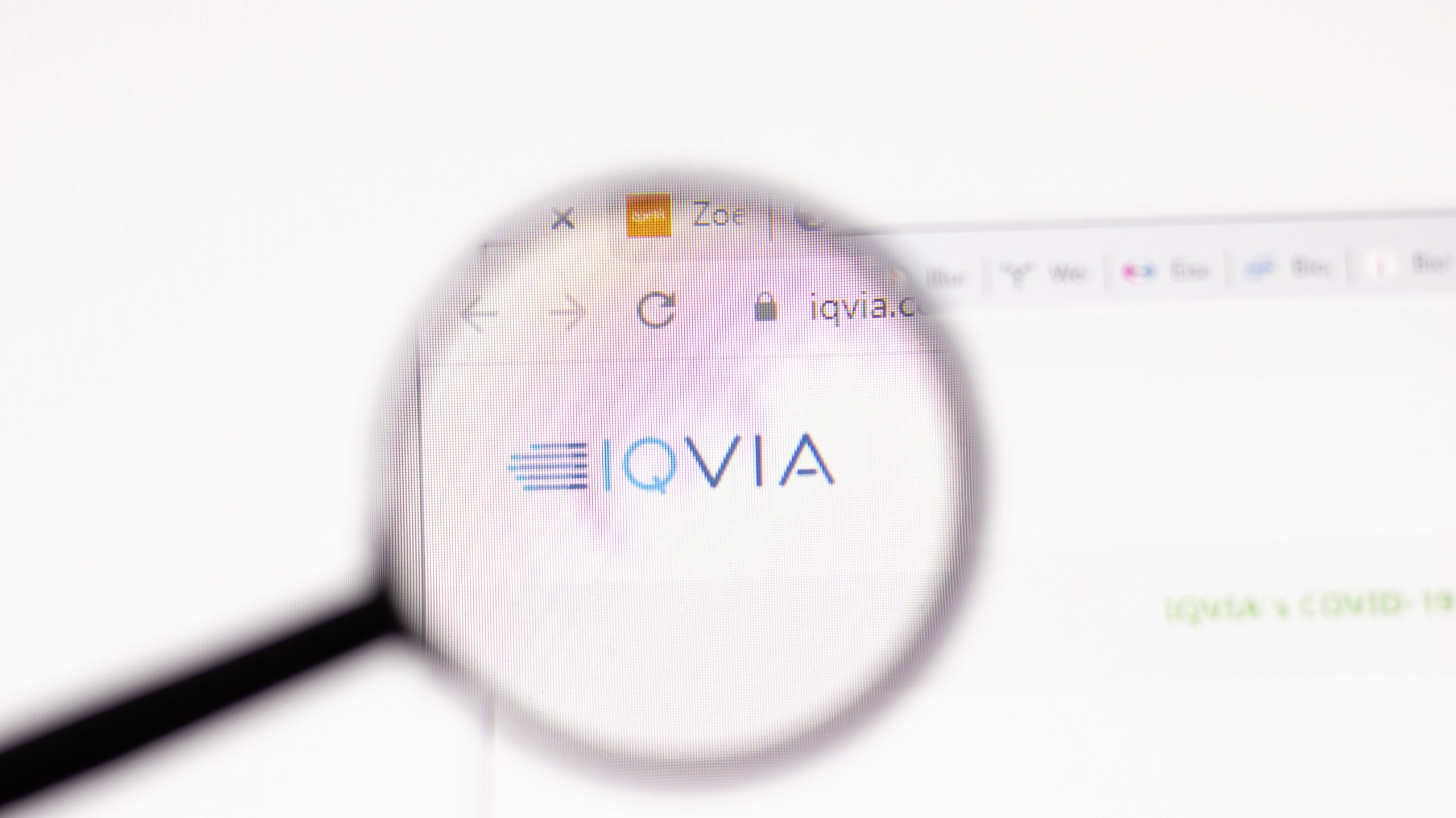 IQVIA's logo magnified displayed on computer screen
